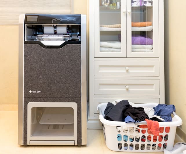 The Foldimate in a laundry room.